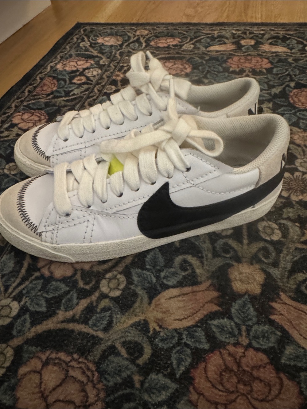 Nike White Sneakers with Black Swoosh and Neon Yellow Tongue Tab